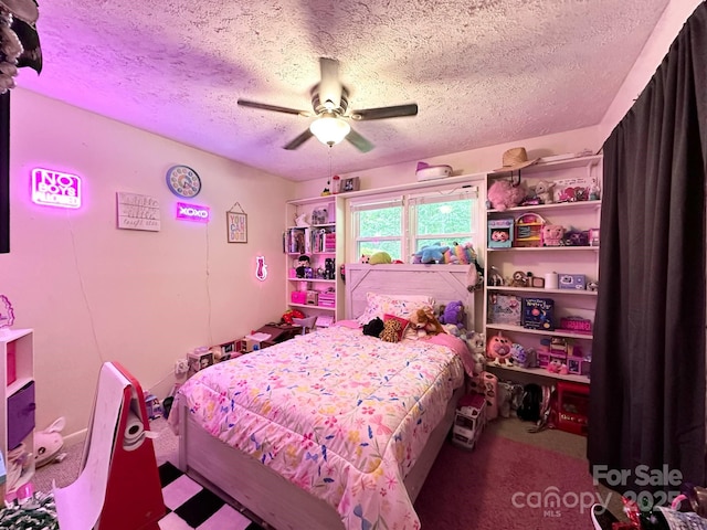 3503 Wyndham Ln, Lenoir, NC 28645 - bedroom with a textured ceiling and a ceiling fan