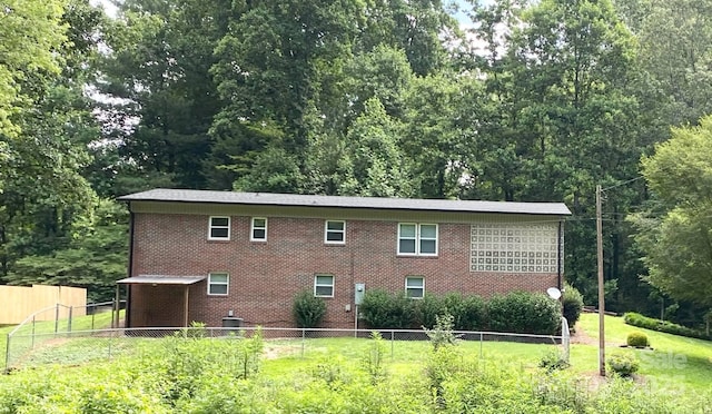 3503 Wyndham Ln, Lenoir, NC 28645 - rear view of property featuring brick siding and a view of trees