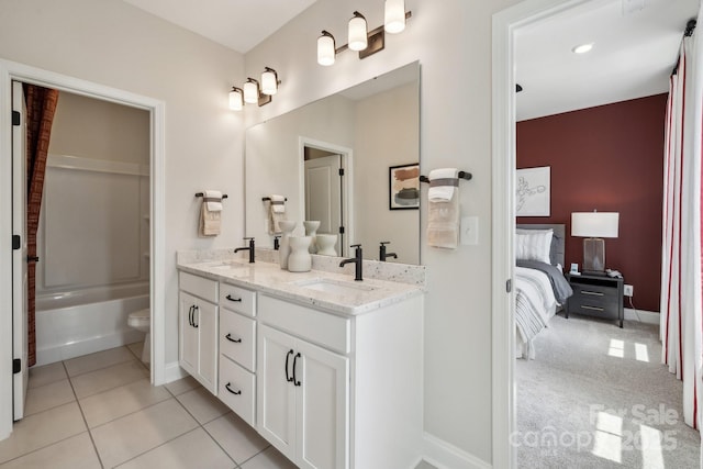 18129 Sulton Ter, Huntersville, NC 28078 - full bath with double vanity, connected bathroom, toilet, tile patterned flooring, and baseboards