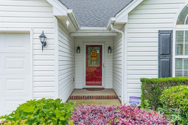 199 Ashmont Dr, Kannapolis, NC 28081 - doorway to property featuring roof with shingles and a garage