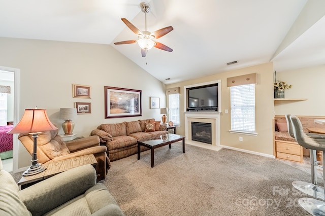 199 Ashmont Dr, Kannapolis, NC 28081 - living area with a glass covered fireplace, ceiling fan, carpet flooring, baseboards, and high vaulted ceiling