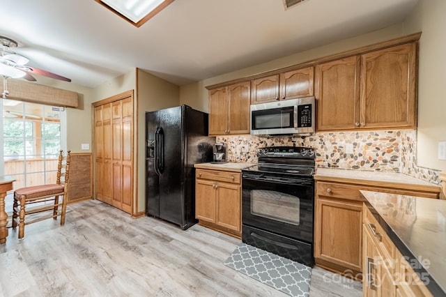 199 Ashmont Dr, Kannapolis, NC 28081 - kitchen featuring black appliances, ceiling fan, light wood-style floors, light countertops, and tasteful backsplash