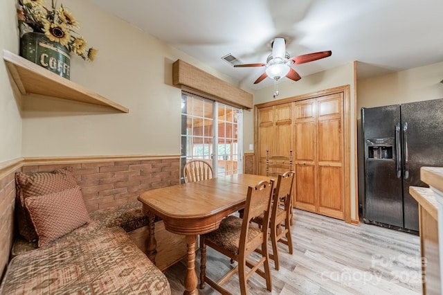 199 Ashmont Dr, Kannapolis, NC 28081 - dining space with wainscoting, light wood-style floors, and ceiling fan