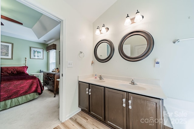 199 Ashmont Dr, Kannapolis, NC 28081 - ensuite bathroom with double vanity, a ceiling fan, and wood finished floors