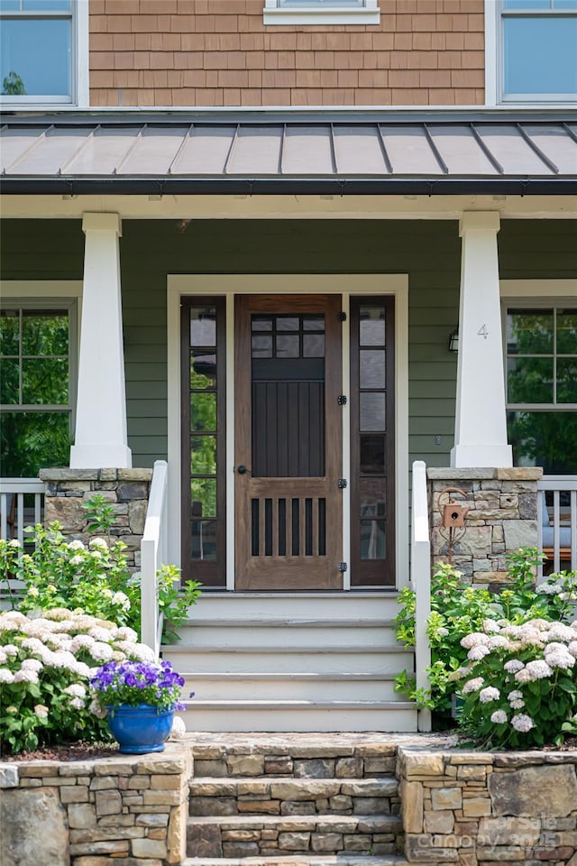 4 Fitzgerald Rd, Black Mountain, NC 28711 - doorway to property featuring covered porch and stone siding