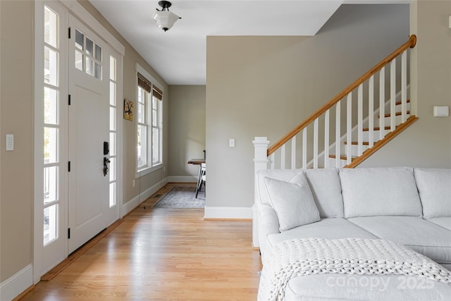 4 Fitzgerald Rd, Black Mountain, NC 28711 - foyer entrance featuring light wood-type flooring, stairway, and baseboards