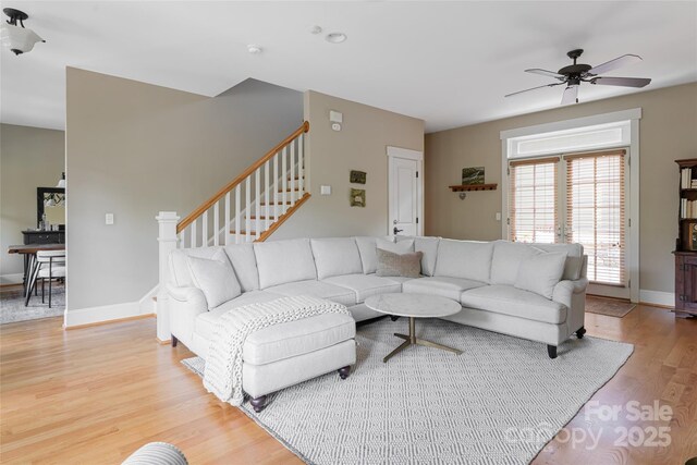 4 Fitzgerald Rd, Black Mountain, NC 28711 - living room with light wood-style flooring, a ceiling fan, stairway, and baseboards