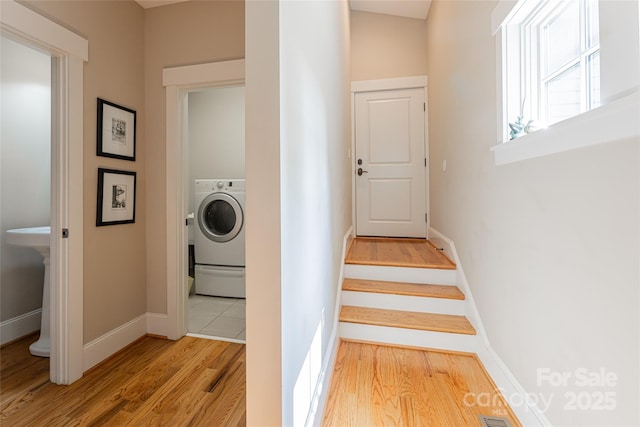 4 Fitzgerald Rd, Black Mountain, NC 28711 - stairs with washer / dryer, wood finished floors, and baseboards