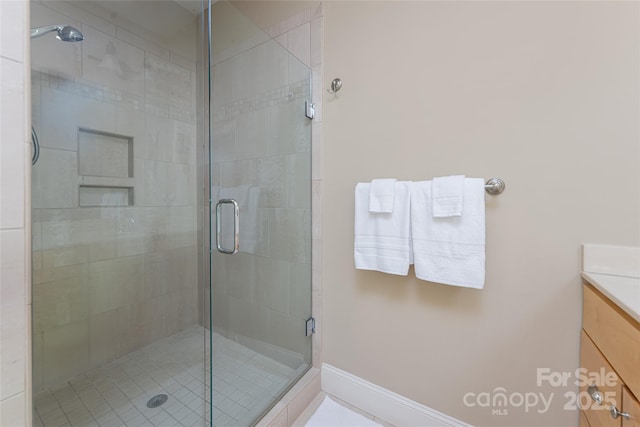 4 Fitzgerald Rd, Black Mountain, NC 28711 - bathroom featuring vanity, a shower stall, and baseboards