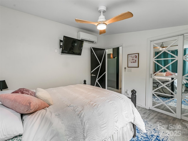 421 Sand Hill Rd, Asheville, NC 28806 - bedroom with wood finished floors, a wall mounted AC, ceiling fan, and access to outside