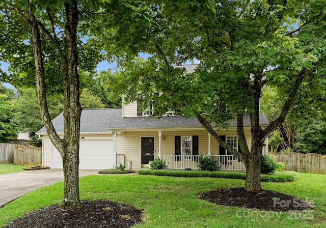 8808 Palmutum Pl, Charlotte, NC 28269 - view of front facade with a porch, roof with shingles, concrete driveway, and a garage
