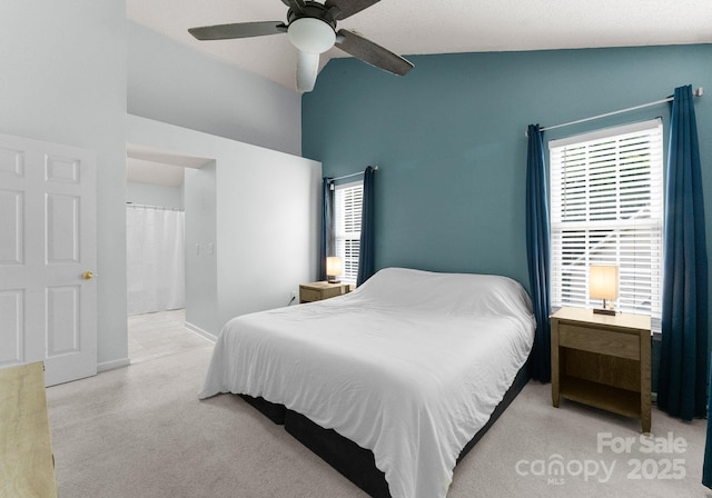 8808 Palmutum Pl, Charlotte, NC 28269 - bedroom featuring multiple windows, high vaulted ceiling, ceiling fan, and baseboards