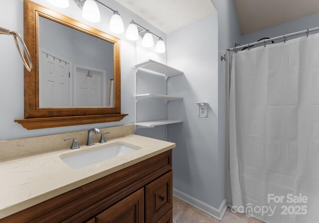 8808 Palmutum Pl, Charlotte, NC 28269 - bathroom with vanity, baseboards, and a shower with curtain