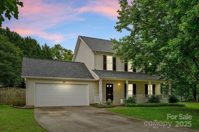 8808 Palmutum Pl, Charlotte, NC 28269 - traditional home featuring a porch, concrete driveway, a garage, and roof with shingles