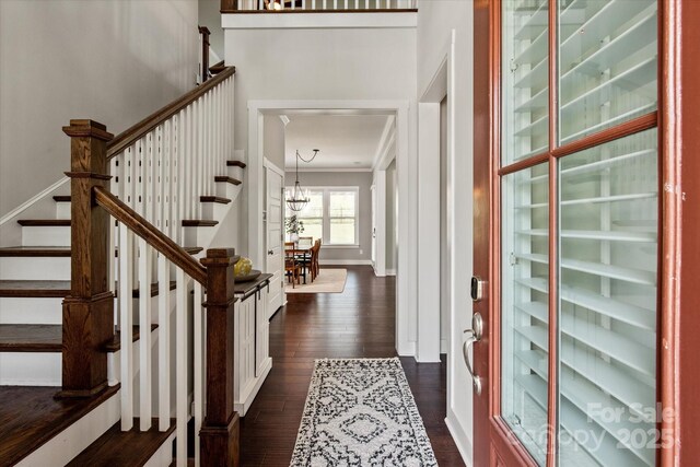 1244 Weir Ct, Fort Mill, SC 29708 - entryway with stairway, a chandelier, dark wood finished floors, crown molding, and baseboards