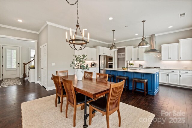 1244 Weir Ct, Fort Mill, SC 29708 - dining room featuring dark wood-style floors, recessed lighting, a chandelier, crown molding, and baseboards