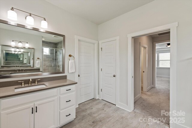 1244 Weir Ct, Fort Mill, SC 29708 - full bathroom with a stall shower, vanity, and baseboards