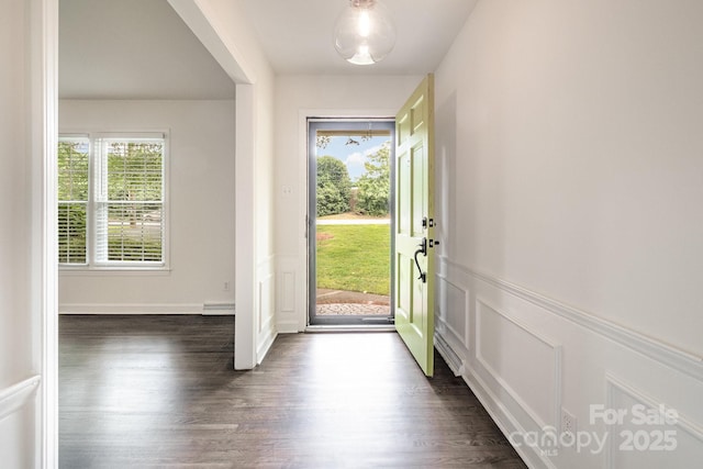 5926 Sharon Rd, Charlotte, NC 28210 - foyer featuring dark wood-style floors, a decorative wall, and wainscoting