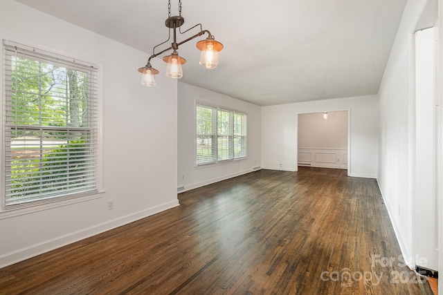 5926 Sharon Rd, Charlotte, NC 28210 - empty room with dark wood finished floors and baseboards