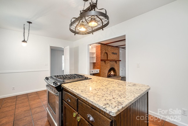 5926 Sharon Rd, Charlotte, NC 28210 - kitchen with stainless steel gas range, baseboards, decorative light fixtures, a fireplace, and a center island