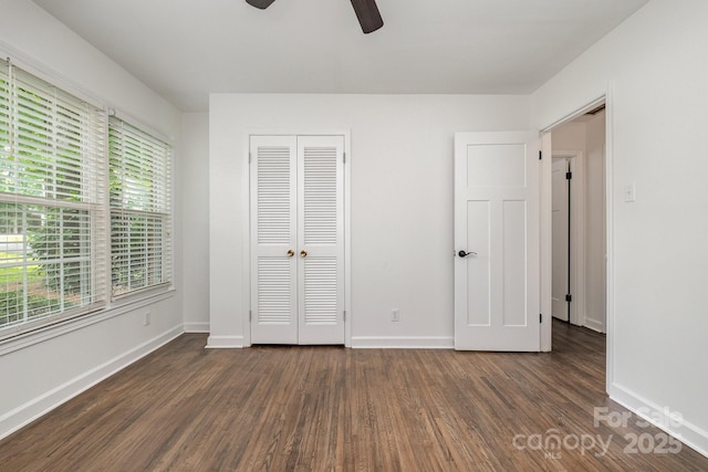 5926 Sharon Rd, Charlotte, NC 28210 - unfurnished bedroom featuring dark wood finished floors, baseboards, a closet, and ceiling fan