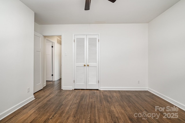 5926 Sharon Rd, Charlotte, NC 28210 - unfurnished bedroom featuring baseboards, dark wood finished floors, a closet, and a ceiling fan