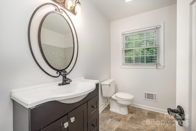5926 Sharon Rd, Charlotte, NC 28210 - bathroom featuring baseboards, vanity, and toilet