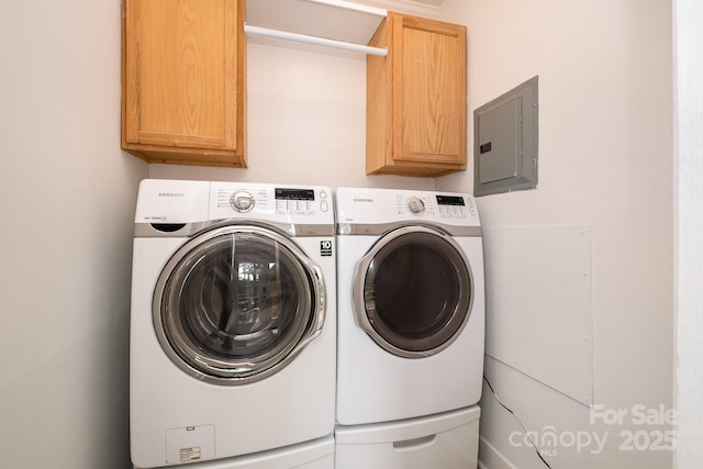 5926 Sharon Rd, Charlotte, NC 28210 - laundry area featuring electric panel, cabinet space, and washing machine and clothes dryer