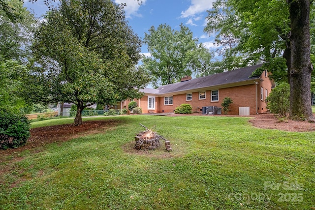 5926 Sharon Rd, Charlotte, NC 28210 - view of yard featuring an outdoor fire pit