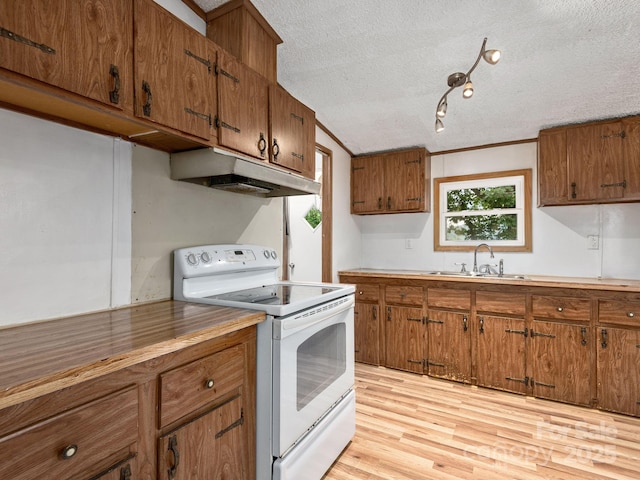 32 Lake Eden Cir, Black Mountain, NC 28711 - kitchen featuring white electric range, under cabinet range hood, brown cabinetry, a textured ceiling, and light wood finished floors