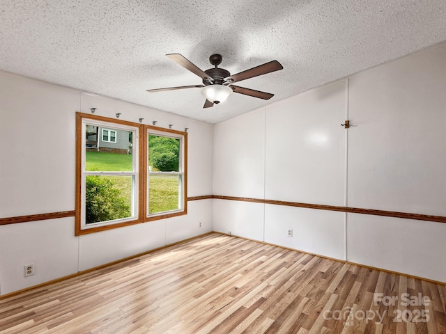 32 Lake Eden Cir, Black Mountain, NC 28711 - spare room with wood finished floors, ceiling fan, and a textured ceiling