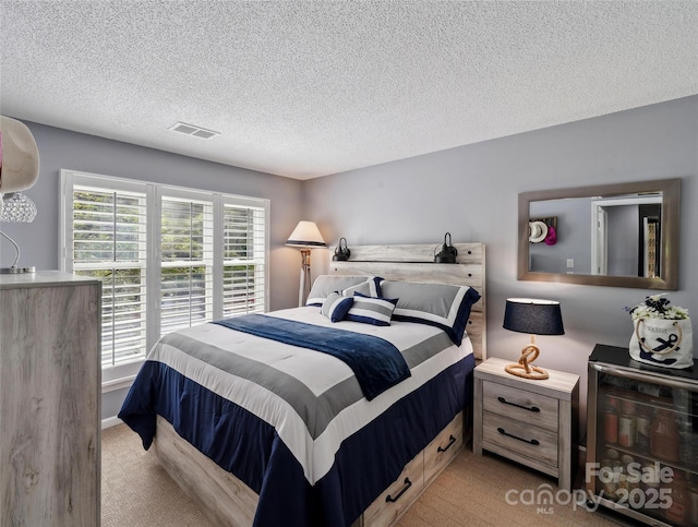 635 Portside Dr, Davidson, NC 28036 - bedroom with a textured ceiling and light colored carpet