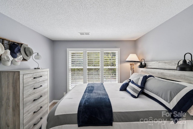 635 Portside Dr, Davidson, NC 28036 - bedroom with a textured ceiling