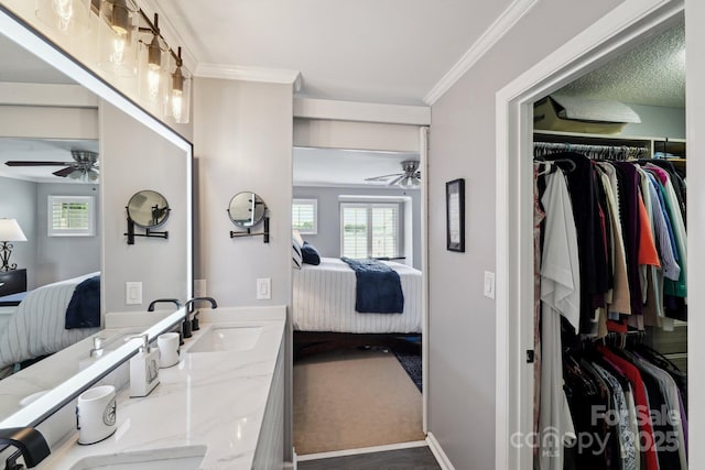 635 Portside Dr, Davidson, NC 28036 - ensuite bathroom featuring a ceiling fan, vanity, healthy amount of natural light, and crown molding