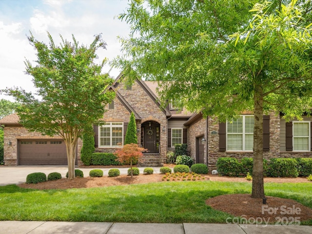 5805 Copperleaf Commons Ct, Charlotte, NC 28277 - view of front of house with stone siding, a garage, driveway, and a front lawn