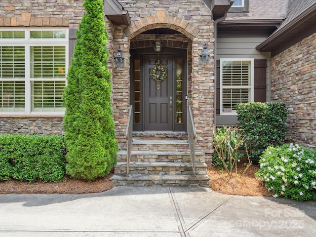 5805 Copperleaf Commons Ct, Charlotte, NC 28277 - entrance to property with stone siding and roof with shingles