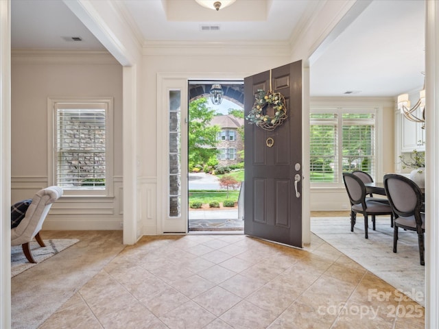 5805 Copperleaf Commons Ct, Charlotte, NC 28277 - foyer featuring light tile patterned flooring, crown molding, and a decorative wall