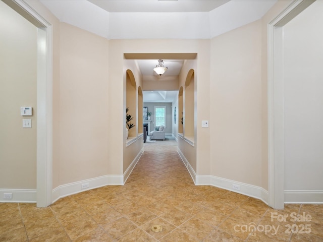 5805 Copperleaf Commons Ct, Charlotte, NC 28277 - hall featuring arched walkways and light tile patterned flooring