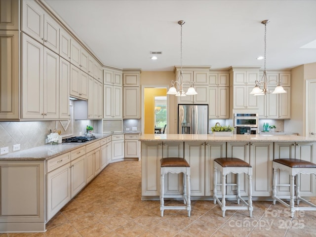 5805 Copperleaf Commons Ct, Charlotte, NC 28277 - kitchen featuring appliances with stainless steel finishes, cream cabinetry, decorative backsplash, and recessed lighting