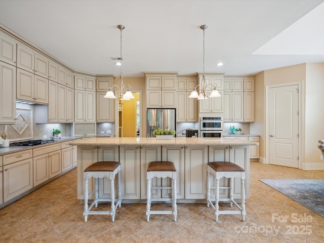 5805 Copperleaf Commons Ct, Charlotte, NC 28277 - kitchen featuring cream cabinets, a chandelier, appliances with stainless steel finishes, backsplash, and recessed lighting