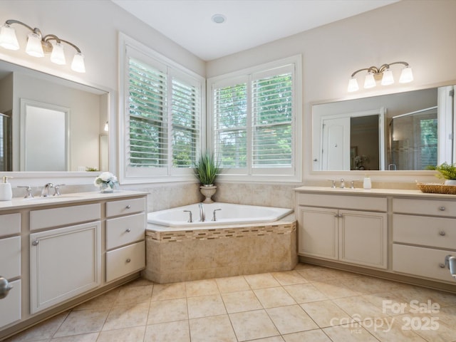 5805 Copperleaf Commons Ct, Charlotte, NC 28277 - full bathroom with two vanities, a shower stall, a garden tub, and tile patterned flooring