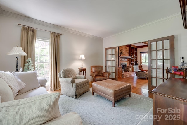 10215 Balmoral Cir, Charlotte, NC 28210 - living room with ornamental molding, wood finished floors, a fireplace, and french doors