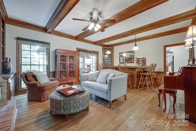 10215 Balmoral Cir, Charlotte, NC 28210 - living area featuring beamed ceiling, light wood finished floors, healthy amount of natural light, a ceiling fan, and bar area