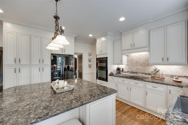 10215 Balmoral Cir, Charlotte, NC 28210 - kitchen featuring black appliances, white cabinetry, ornamental molding, light wood finished floors, and recessed lighting