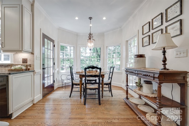 10215 Balmoral Cir, Charlotte, NC 28210 - dining space featuring crown molding, recessed lighting, and light wood finished floors