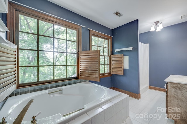 10215 Balmoral Cir, Charlotte, NC 28210 - full bath with a garden tub, a shower with shower curtain, tile patterned flooring, and vanity