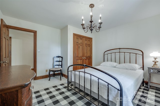 10215 Balmoral Cir, Charlotte, NC 28210 - carpeted bedroom with a chandelier and baseboards