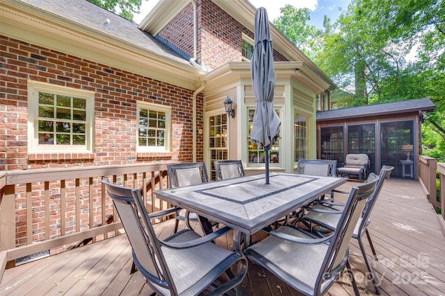 10215 Balmoral Cir, Charlotte, NC 28210 - wooden terrace featuring a sunroom and outdoor dining space