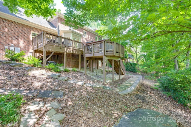 10215 Balmoral Cir, Charlotte, NC 28210 - rear view of property featuring stairs, a deck, and brick siding