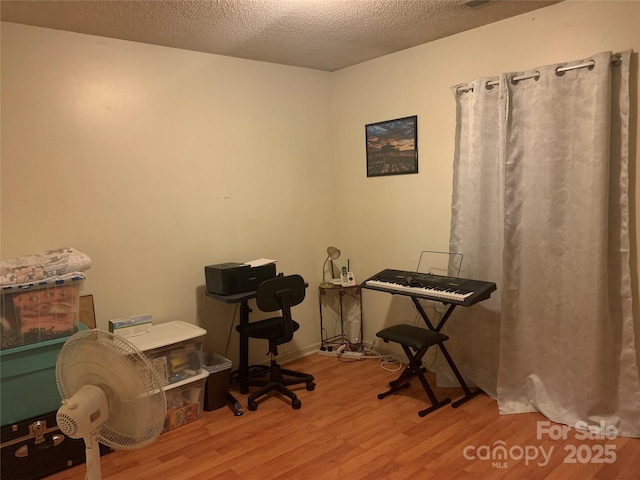 5816 Rocky Mount Ct, Charlotte, NC 28214 - office area with wood finished floors and a textured ceiling